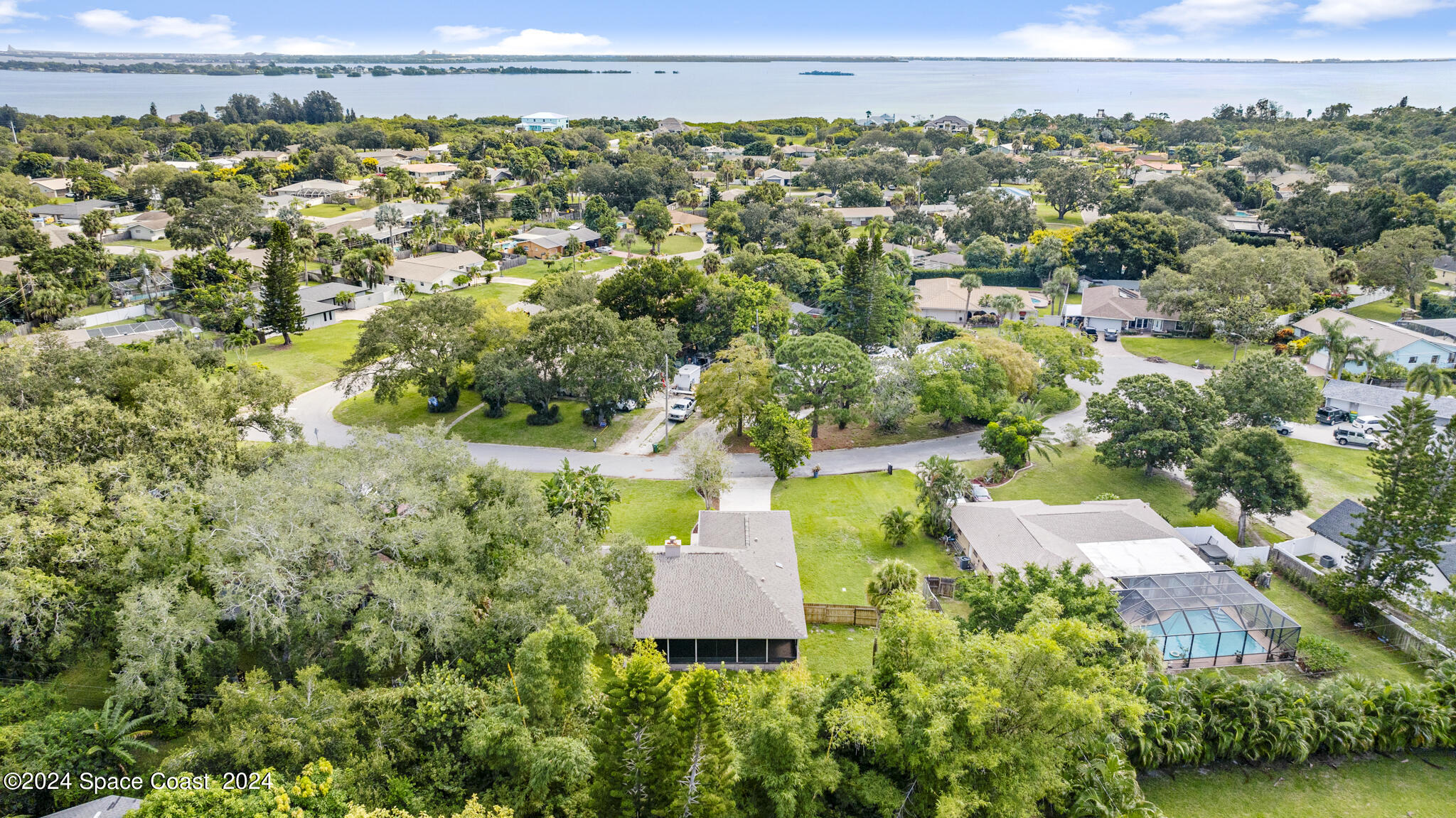 3725 Laurette Road Merritt Island, FL 32952 - Photo 4 of 46 an aerial view of a house with a yard