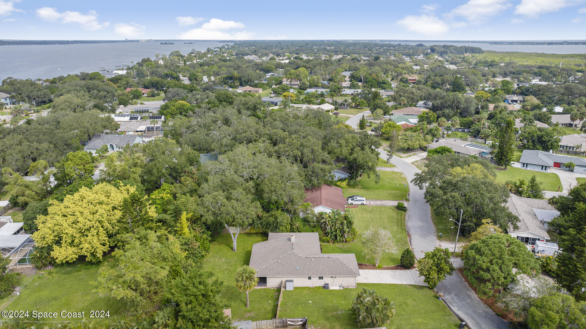 3725 Laurette Road Merritt Island, FL 32952 - Photo 45 of 46 an aerial view of a city with lots of residential buildings