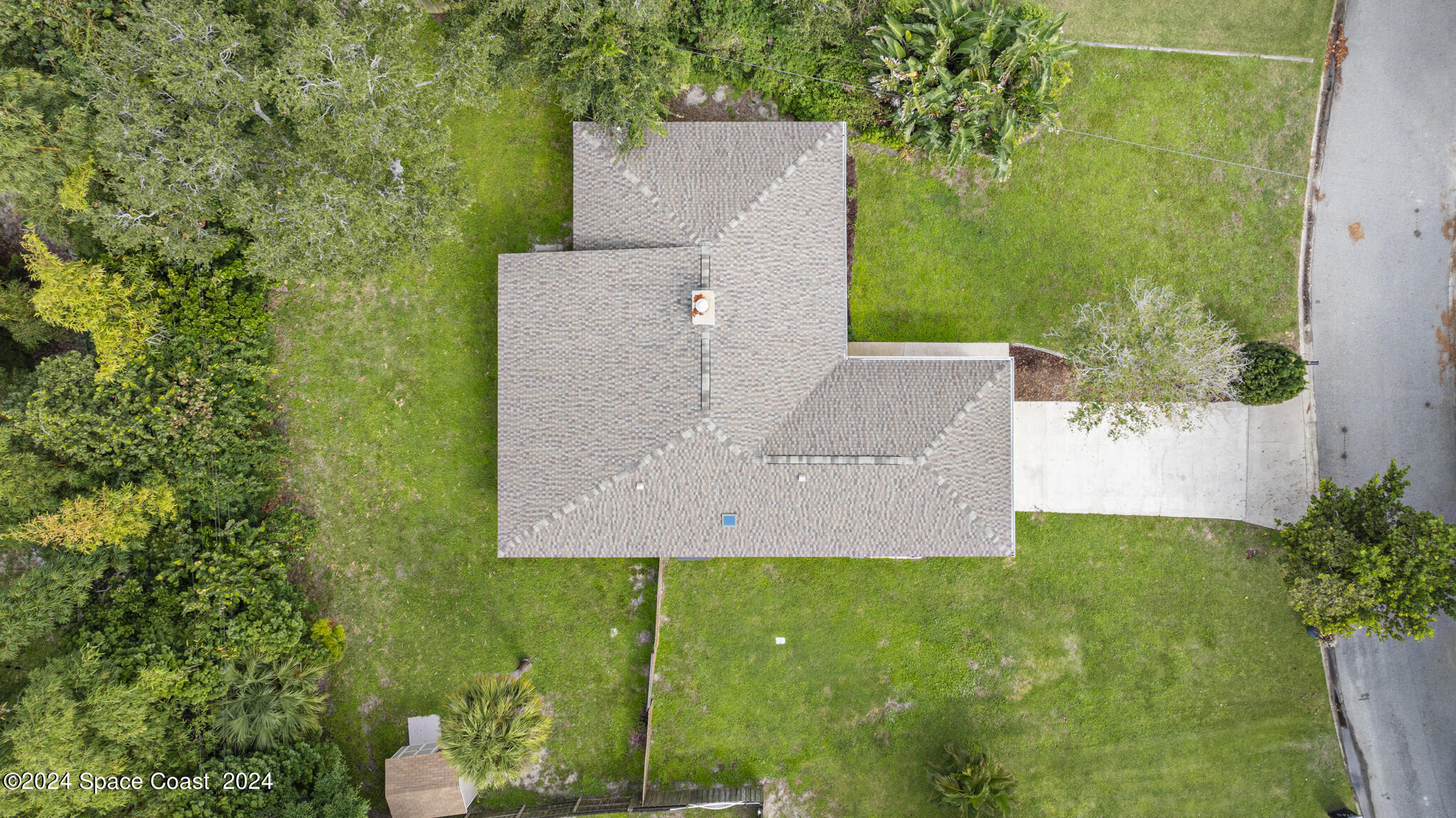 3725 Laurette Road Merritt Island, FL 32952 - Photo 5 of 46 an aerial view of residential house with outdoor space and trees all around