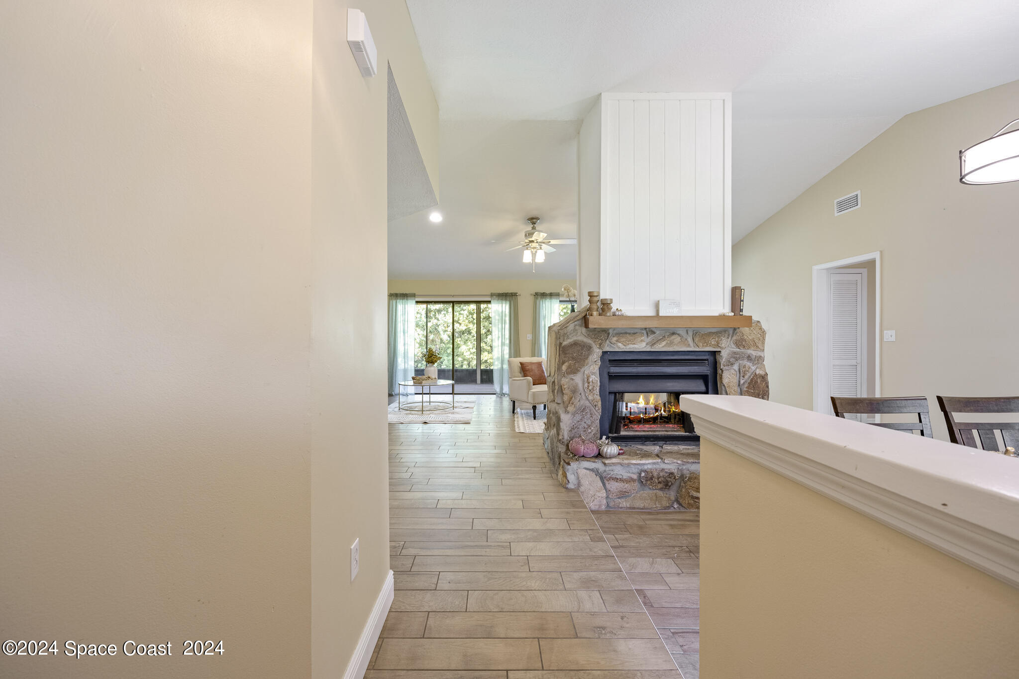 3725 Laurette Road Merritt Island, FL 32952 - Photo 6 of 46 a living room with furniture and a fireplace