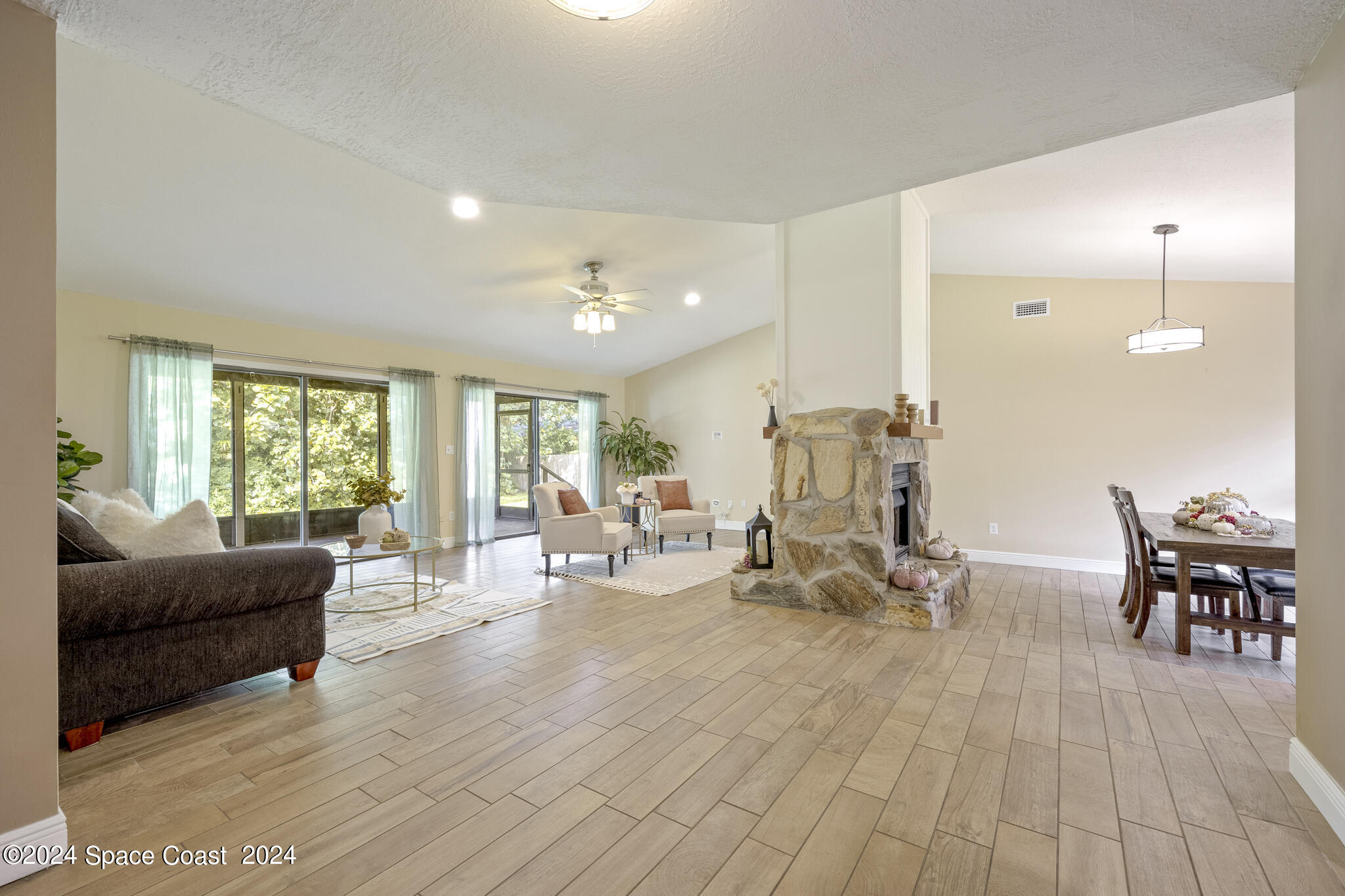 3725 Laurette Road Merritt Island, FL 32952 - Photo 9 of 46 a living room with furniture and wooden floor