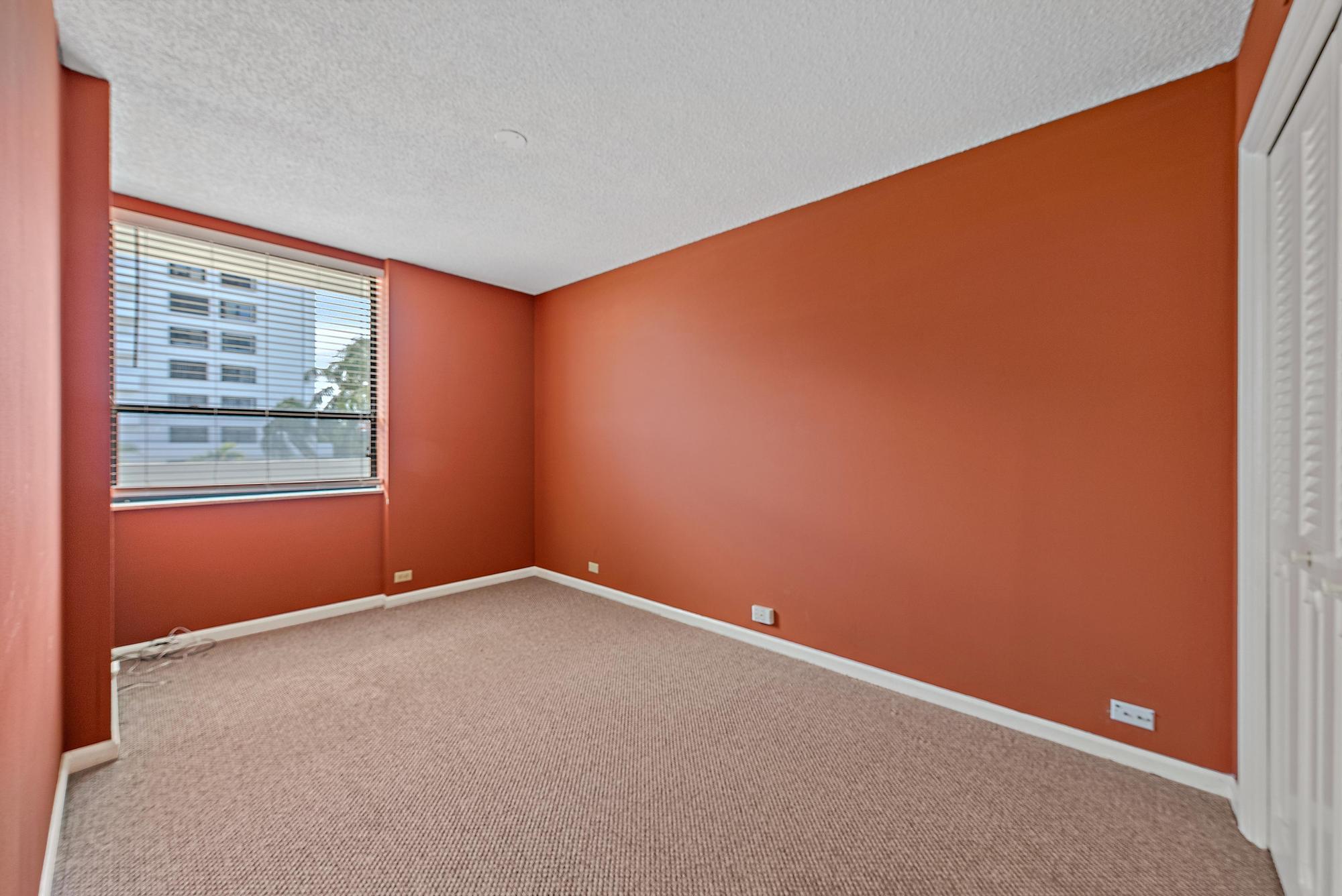 1208 Marine Way, Unit 105 North Palm Beach, FL 33408 - Photo 11 of 22 an empty room with windows