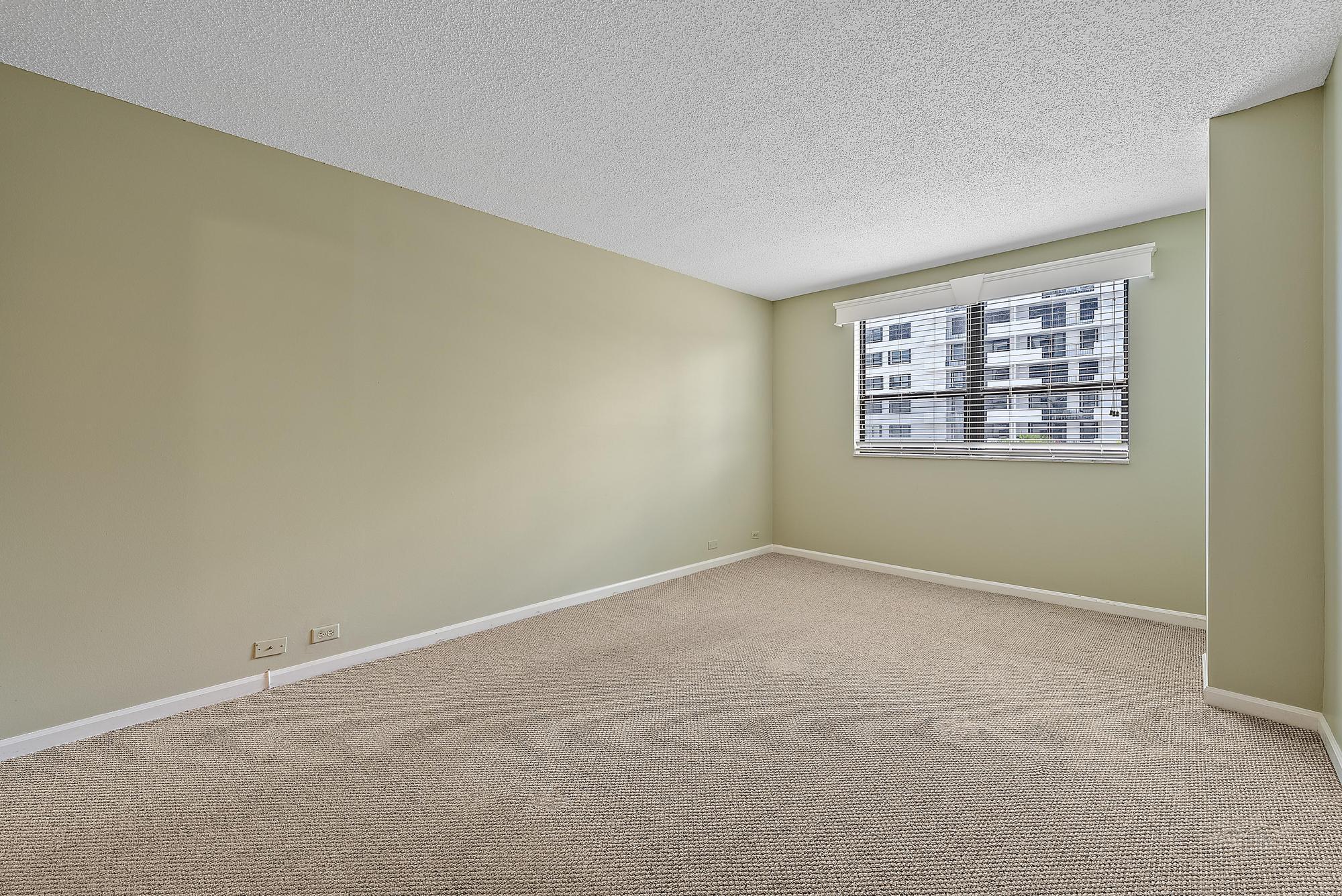 1208 Marine Way, Unit 105 North Palm Beach, FL 33408 - Photo 14 of 22 an empty room with a window