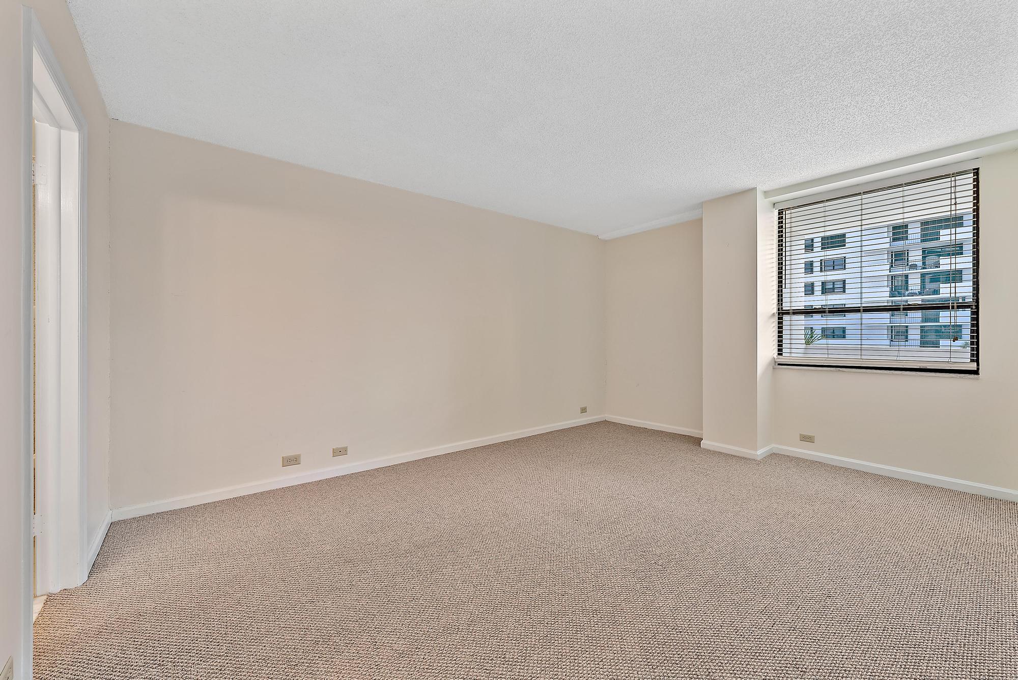 1208 Marine Way, Unit 105 North Palm Beach, FL 33408 - Photo 15 of 22 an empty room with windows