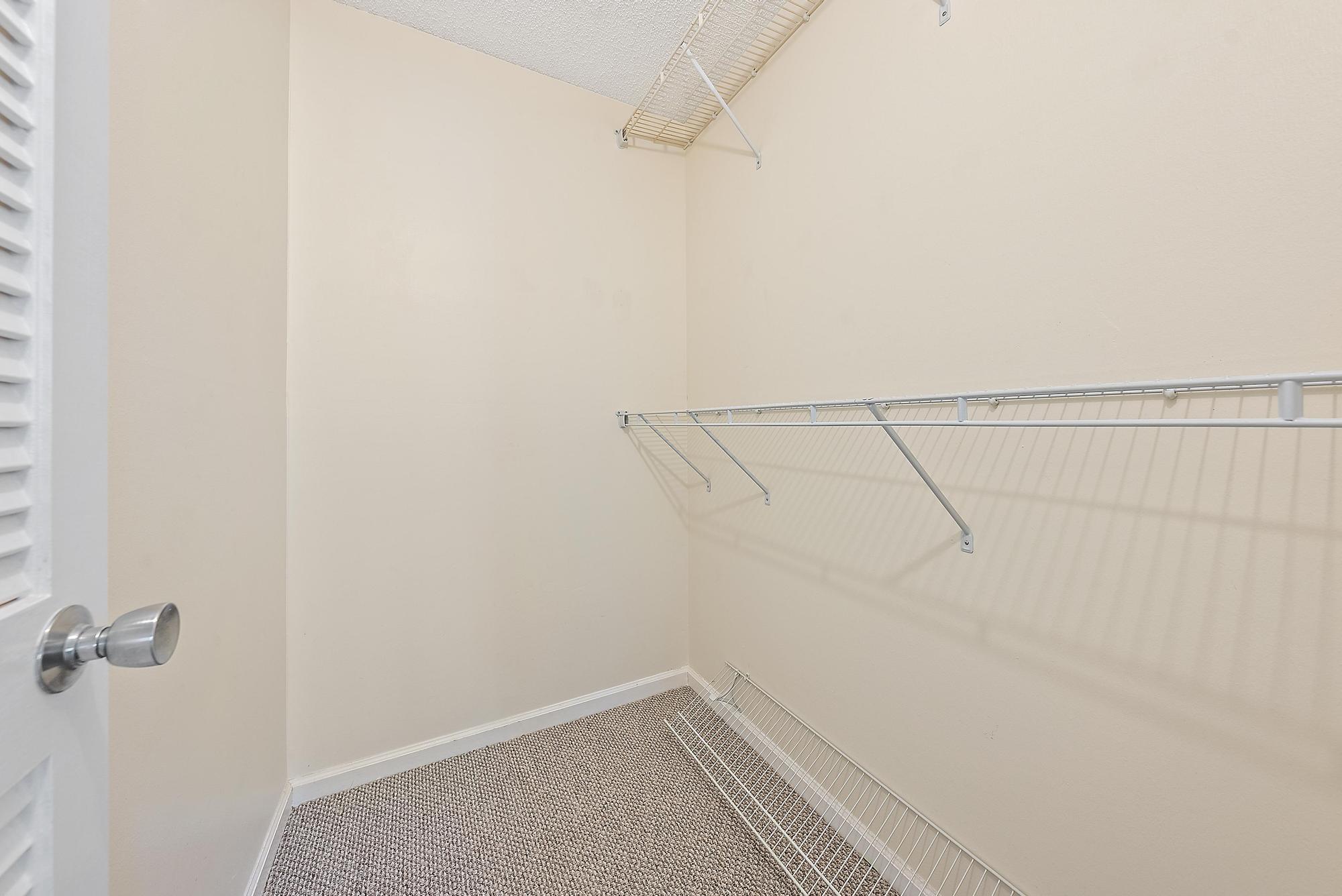 1208 Marine Way, Unit 105 North Palm Beach, FL 33408 - Photo 16 of 22 a view of a room with racks on the wall