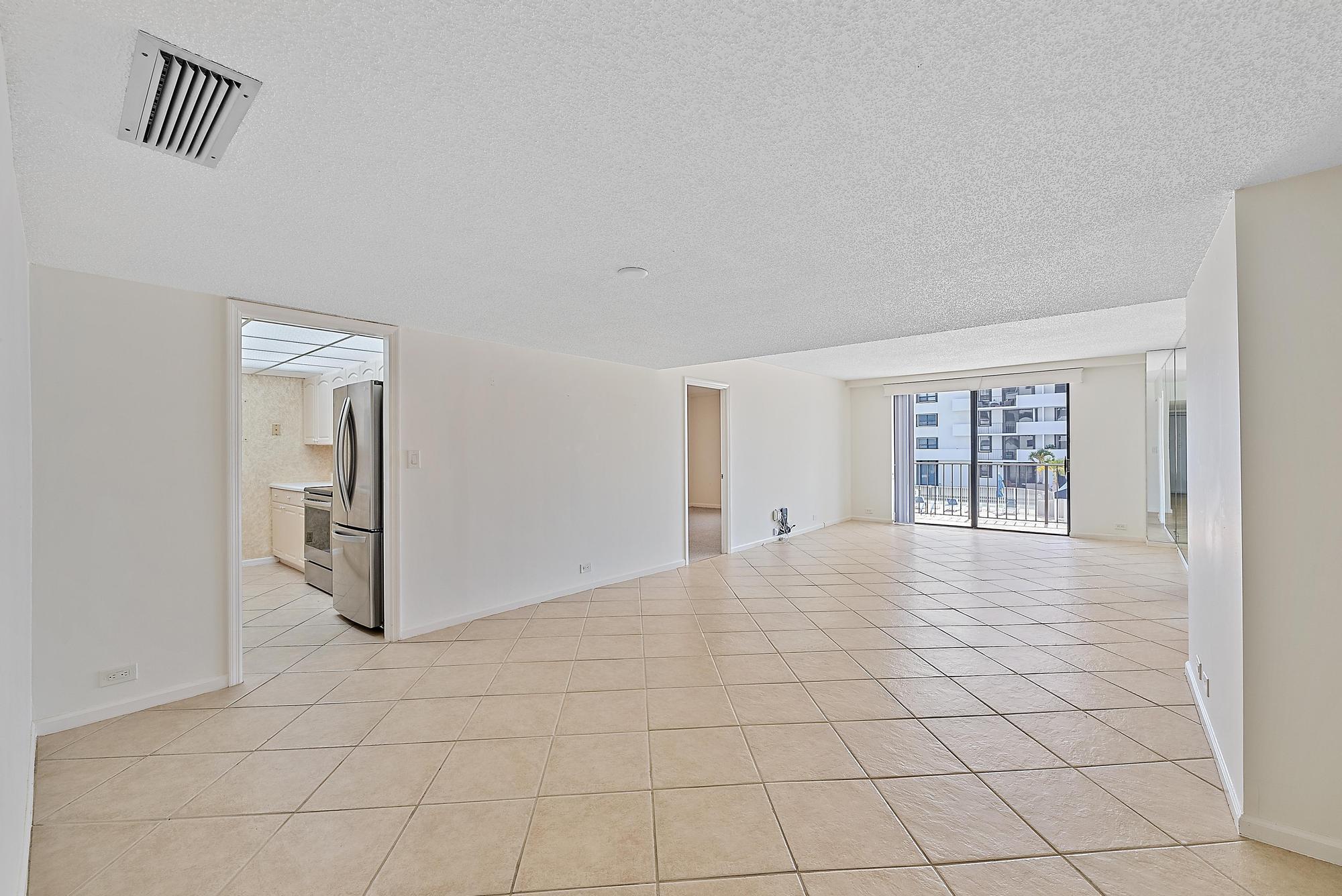1208 Marine Way, Unit 105 North Palm Beach, FL 33408 - Photo 3 of 22 a view of an empty room and window