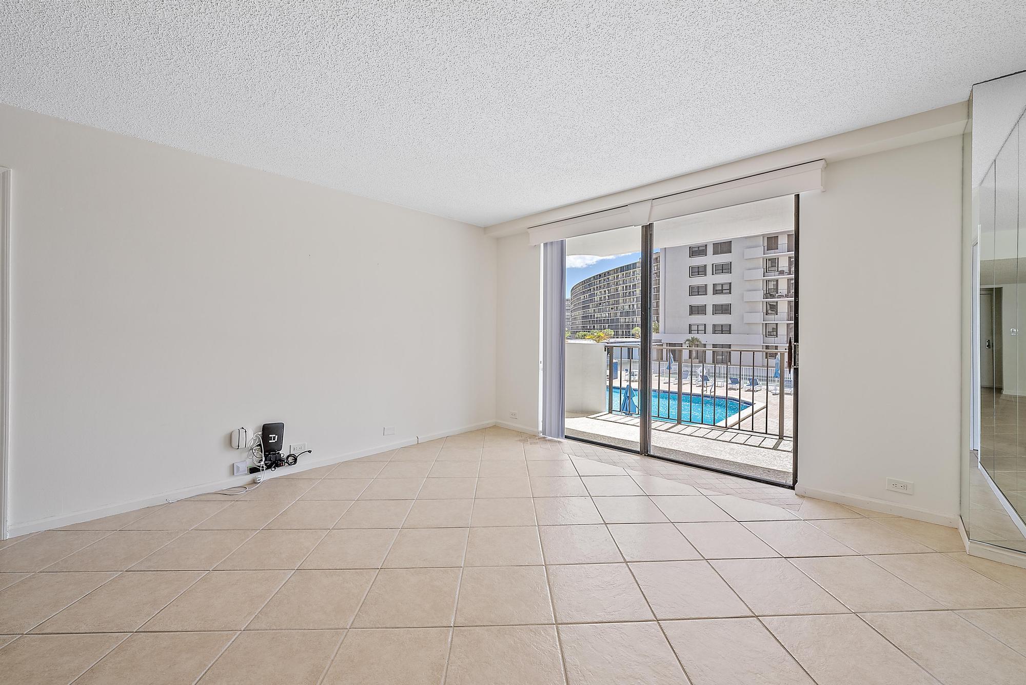 1208 Marine Way, Unit 105 North Palm Beach, FL 33408 - Photo 6 of 22 a view of an empty room and window