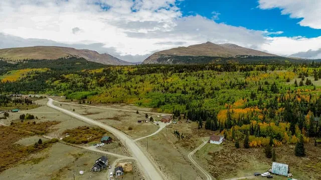 a view of a city with mountains in the background