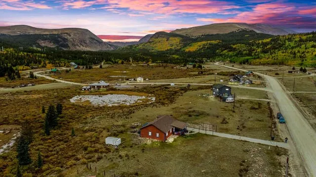 a view of a town with mountains in the background