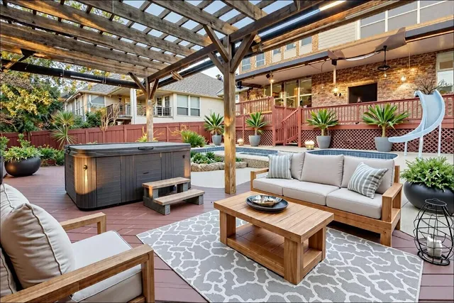 a outdoor living space with furniture and a fireplace