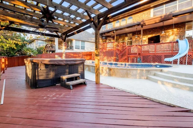 a view of a swimming pool with outdoor seating