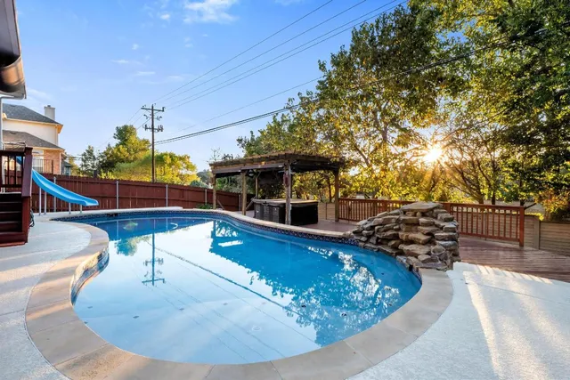 a view of a swimming pool with a patio