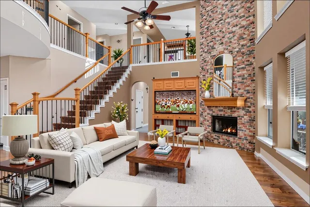 a outdoor living with fireplace furniture and a potted plant