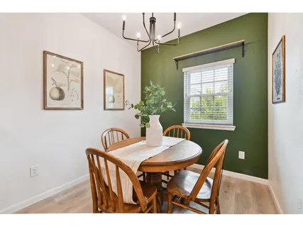 a view of a dining room with furniture and window