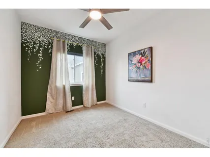 a view of an empty room with a fireplace