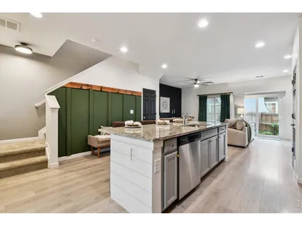 a kitchen with sink and cabinets