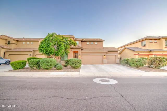a house with a yard and a garage