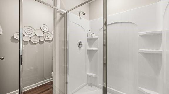 517 Almere Drive Hampton, GA 30228 - Photo 32 of 41 a bathroom with a shower and a glass door