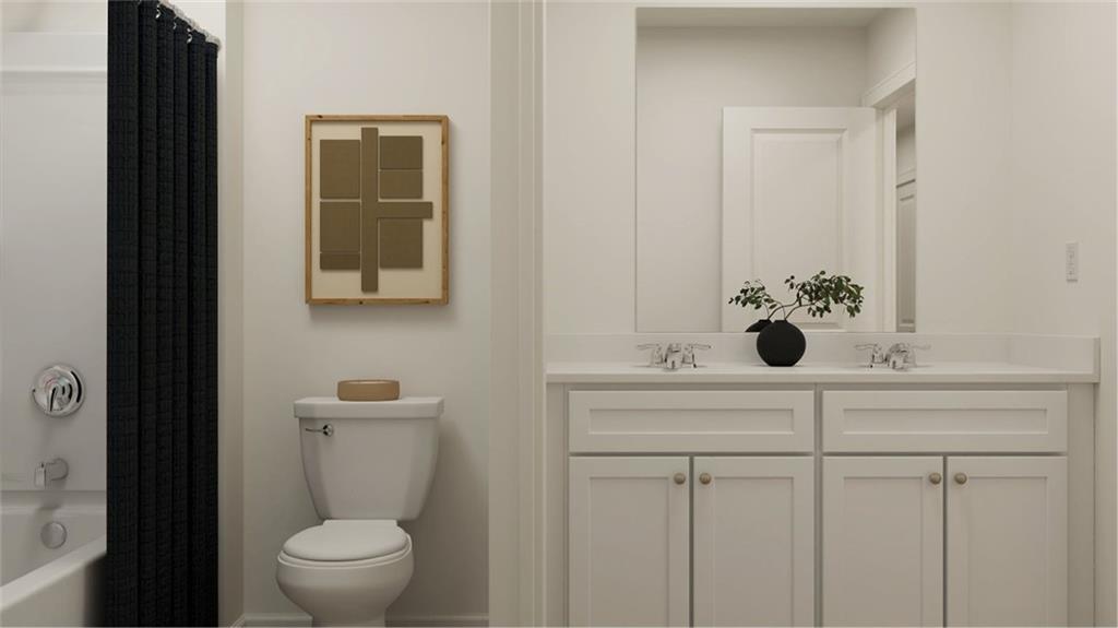 517 Almere Drive Hampton, GA 30228 - Photo 5 of 41 a bathroom with a sink and mirror with toilet