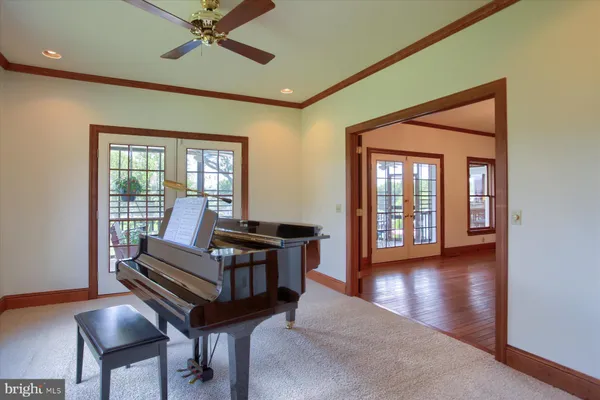 a view of a dining room with furniture wooden floor and chandelier