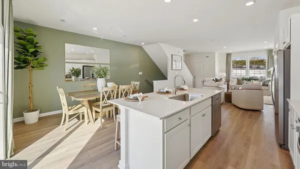 a kitchen with a sink and stove top oven