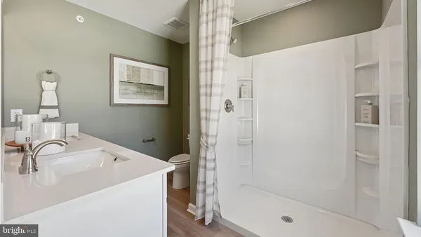 a bathroom with a sink and a shower