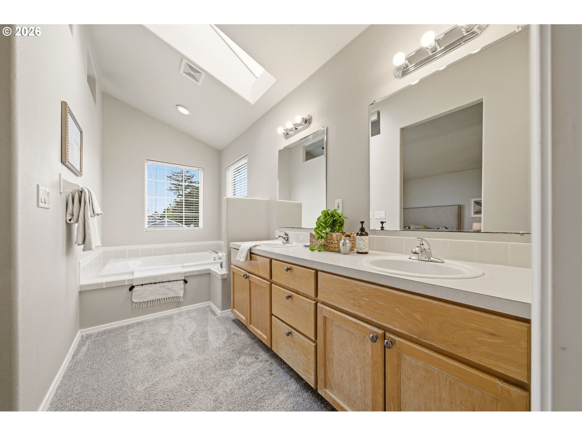 1448 Southwest 208th Avenue Beaverton, OR 97003 - Photo 27 of 39 a bathroom with a sink double vanity granite tub shower and a mirror