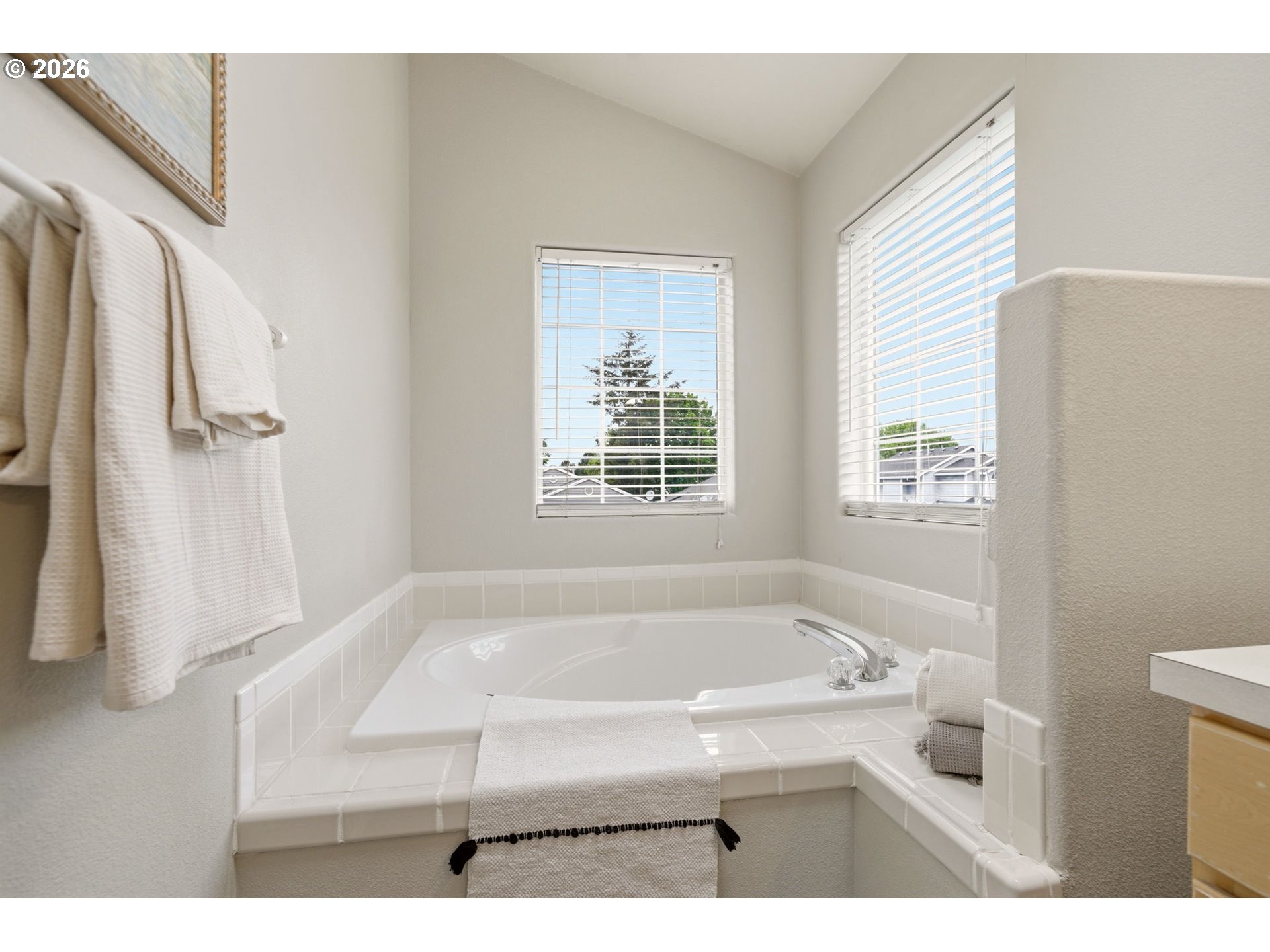 1448 Southwest 208th Avenue Beaverton, OR 97003 - Photo 28 of 39 a bathroom with a bathtub and a window
