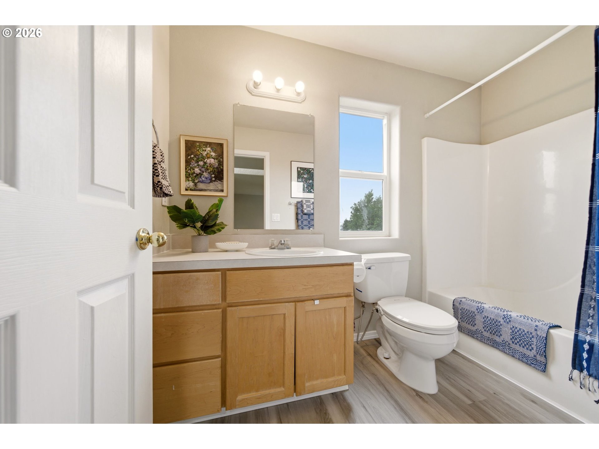 1448 Southwest 208th Avenue Beaverton, OR 97003 - Photo 33 of 39 a bathroom with a sink a toilet a mirror a vanity and shower