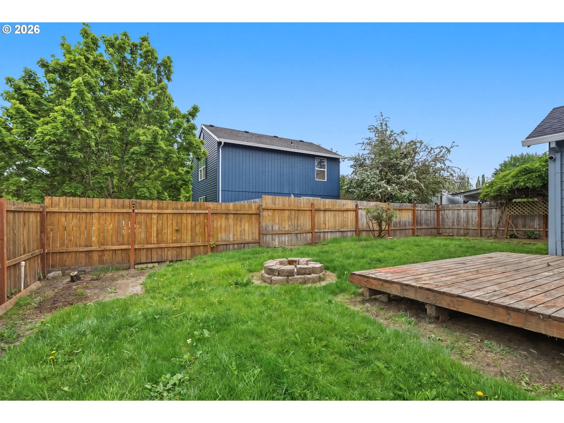 1448 Southwest 208th Avenue Beaverton, OR 97003 - Photo 38 of 39 a view of a backyard with wooden fence