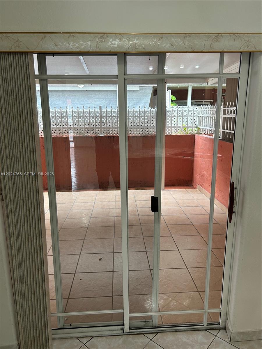 10919 West Okeechobee Road, Unit 101 Hialeah Gardens, FL 33018 - Photo 13 of 21 a view of entryway