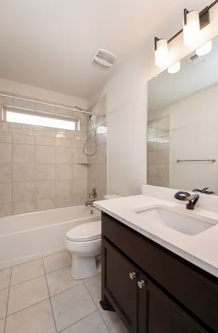a view of a livingroom with wooden floor and a window