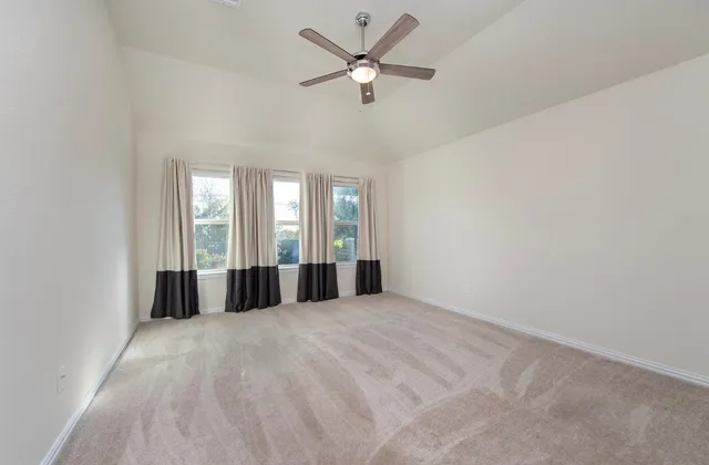 a view of kitchen with white cabinets
