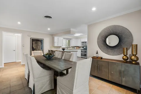 a kitchen with a table and chairs in it