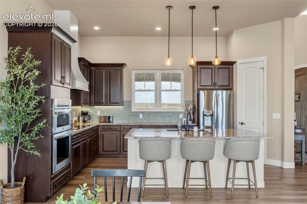 2480 North Log Road Calhan, CO 80808 - Photo 6 of 50 Spacious kitchen with granite and imported tile