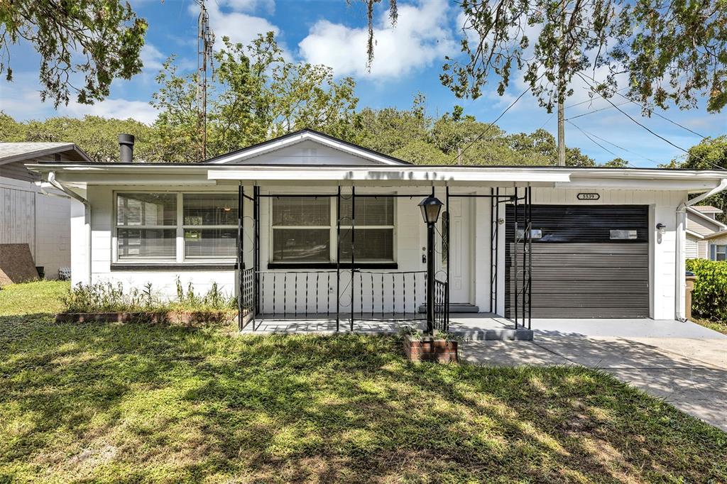 5539 Bertsville Road Lady Lake, FL 32159 - Photo 1 of 1 a front view of a house with a garden