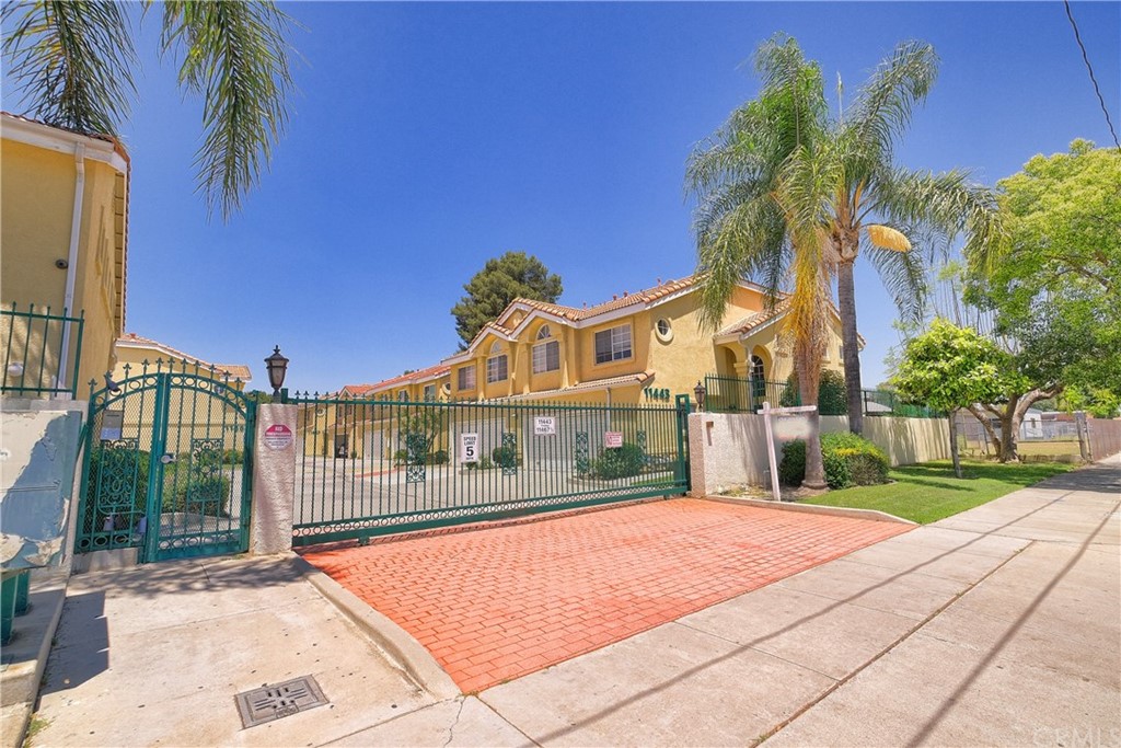 a view of a building with a yard