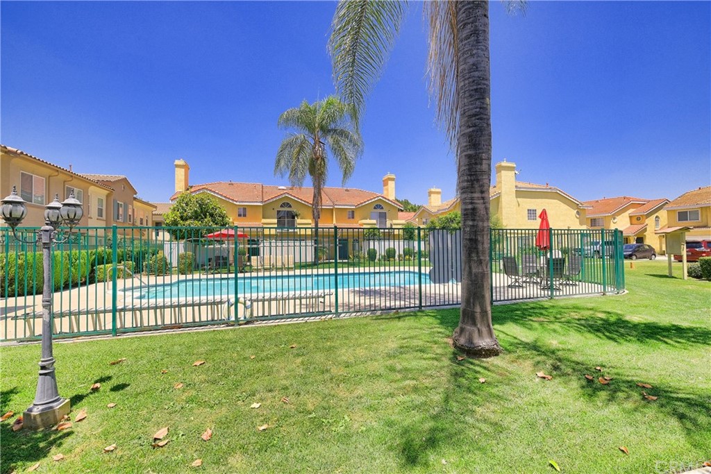 11445 Excelsior Drive Norwalk, CA 90650 - Photo 17 of 18 a view of a garden with a building in the background