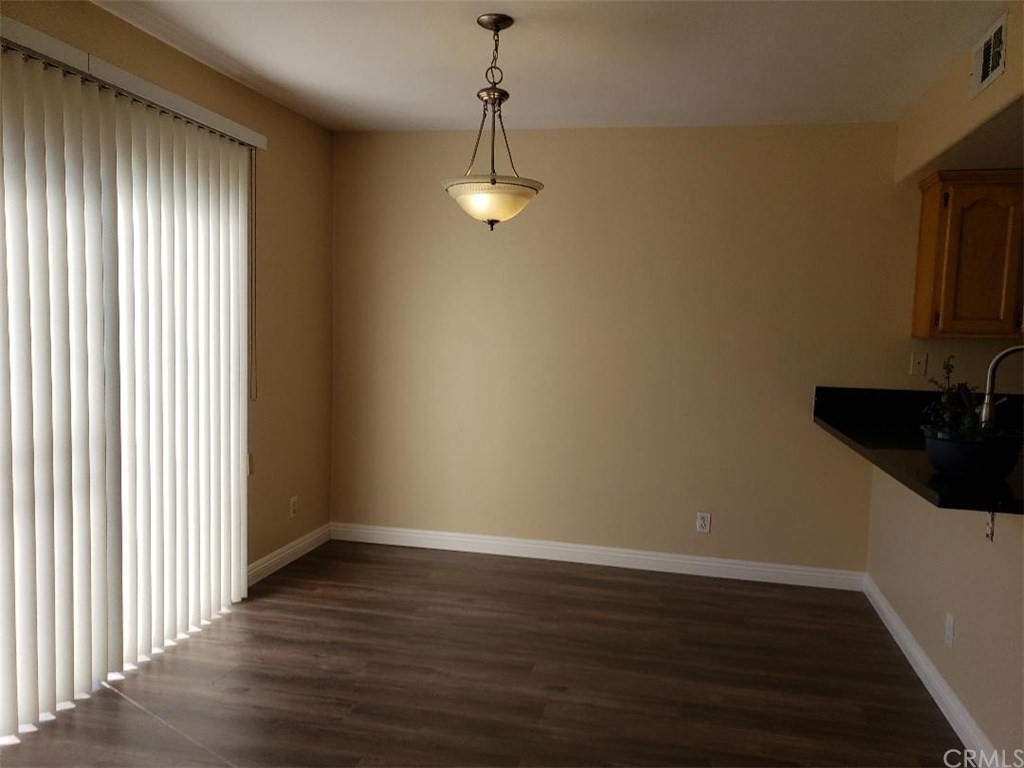 11445 Excelsior Drive Norwalk, CA 90650 - Photo 6 of 18 a view of empty room with wooden floor and fan