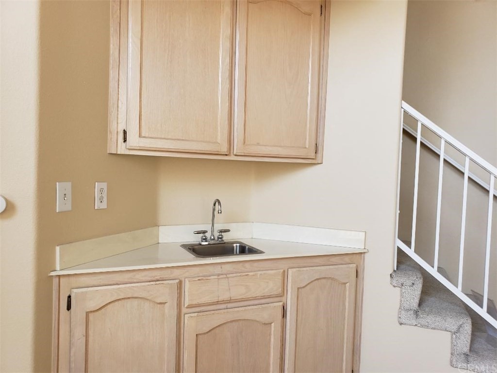 11445 Excelsior Drive Norwalk, CA 90650 - Photo 9 of 18 a kitchen with white cabinets and a sink