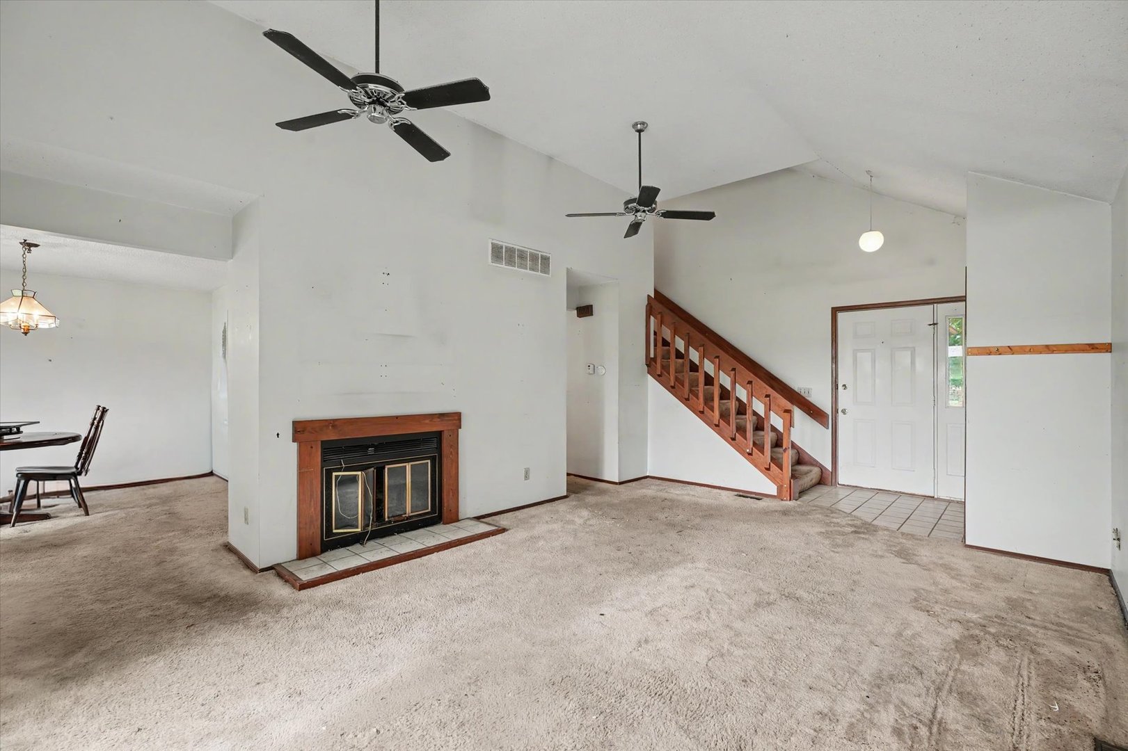 711 Higgins Road Champaign, IL 61822 - Photo 6 of 23 a view of an empty room with a fireplace