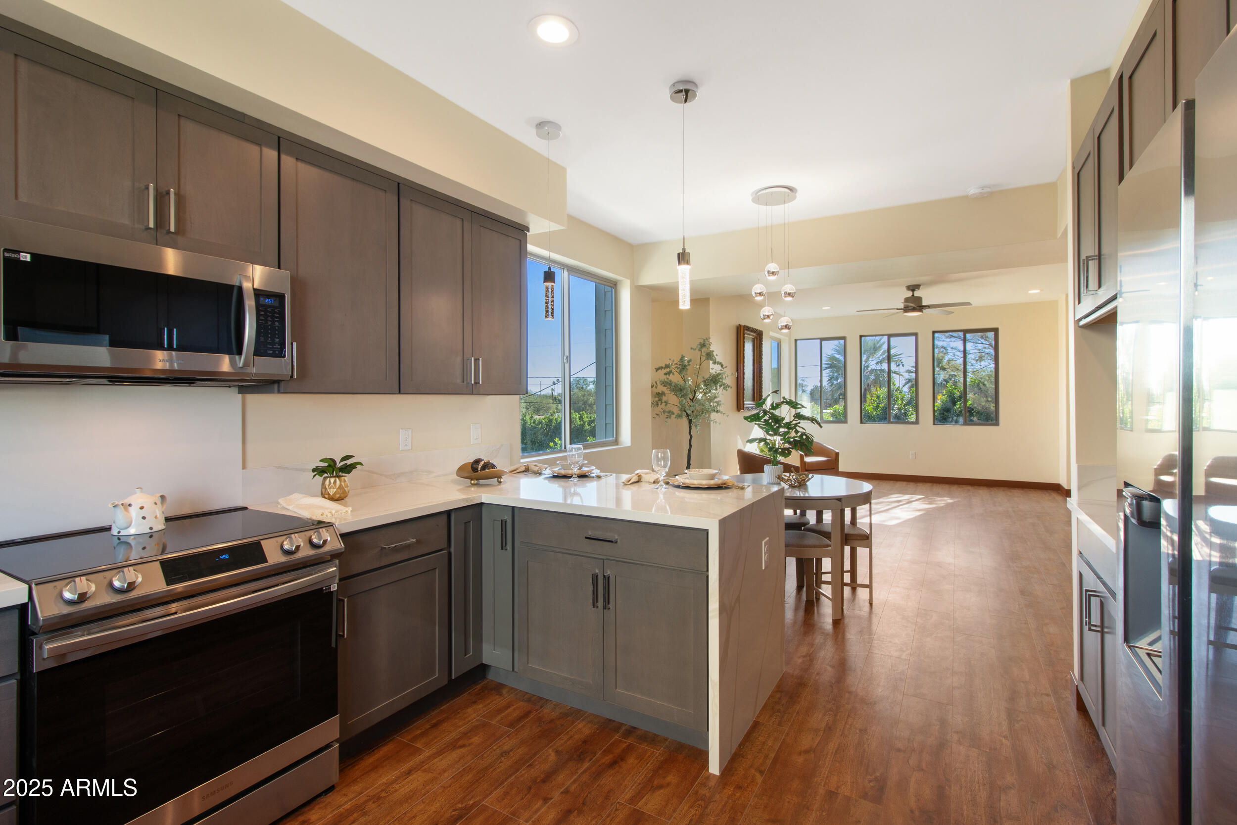 2014 West Lawrence Road Phoenix, AZ 85015 - Photo 13 of 24 a kitchen with a sink a microwave and cabinets