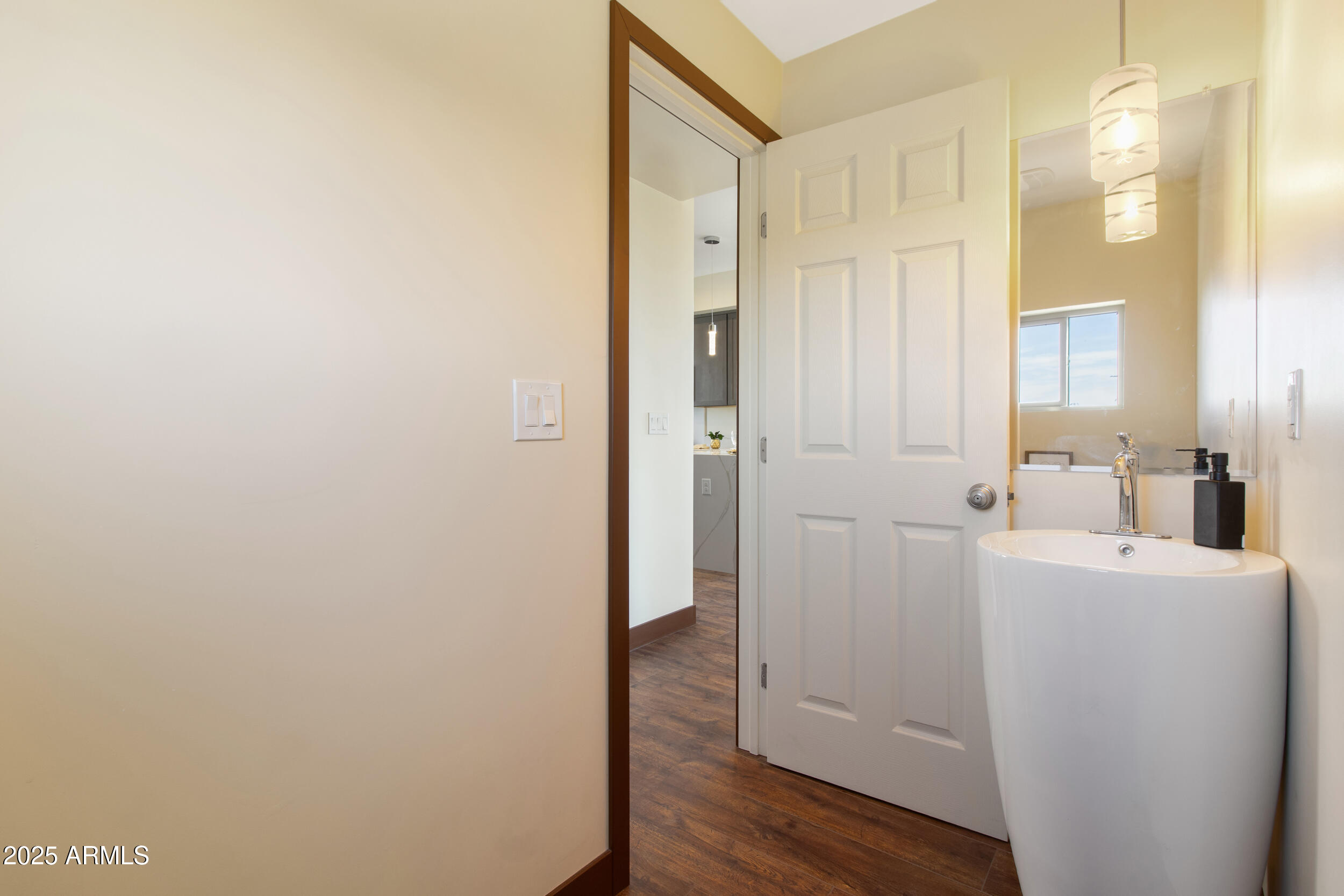 2014 West Lawrence Road Phoenix, AZ 85015 - Photo 15 of 24 a bathroom with a sink a mirror and a shower