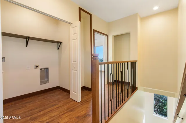 a bedroom with bed and a chandelier
