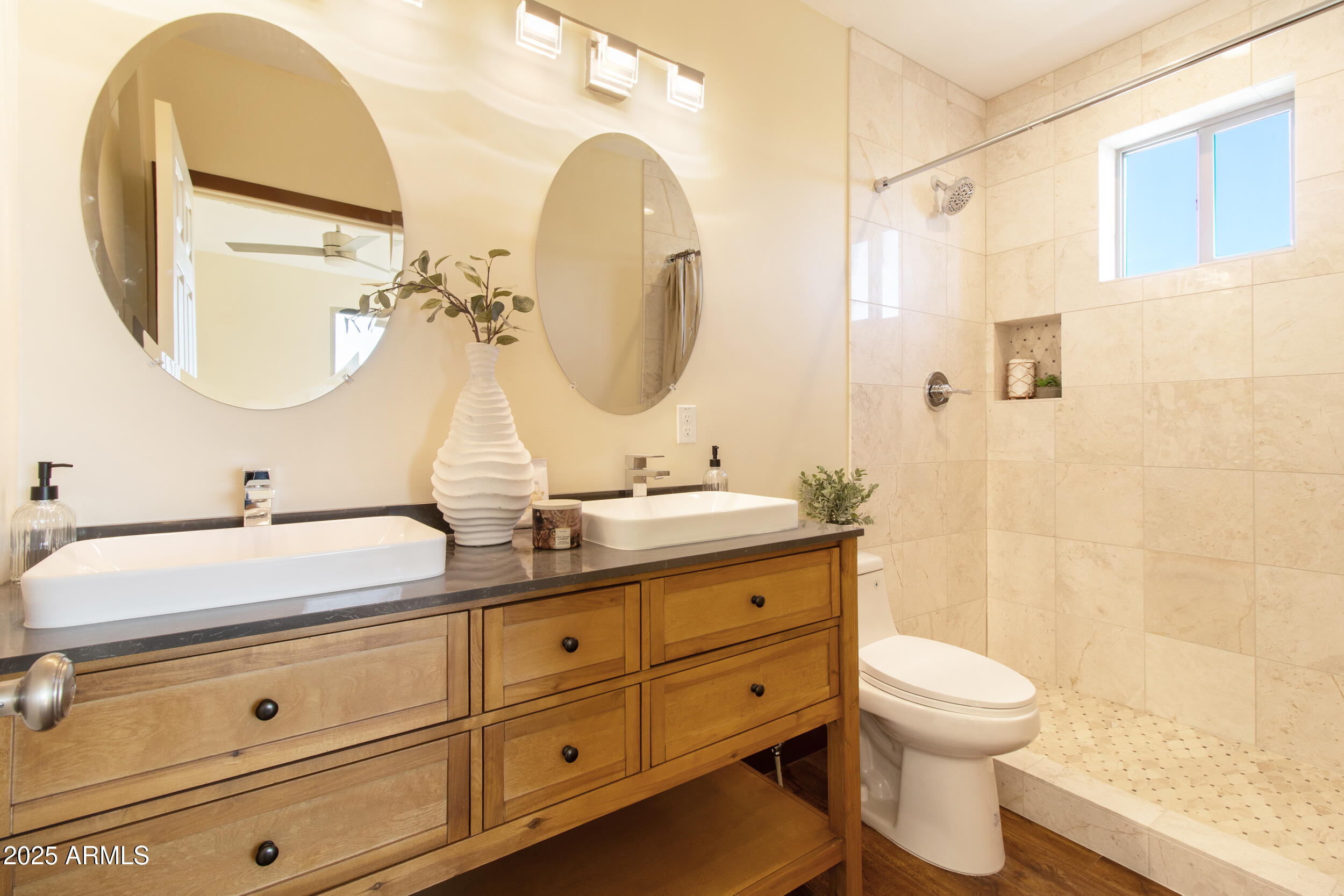 2014 West Lawrence Road Phoenix, AZ 85015 - Photo 18 of 24 a bathroom with a double vanity sink mirror and toilet