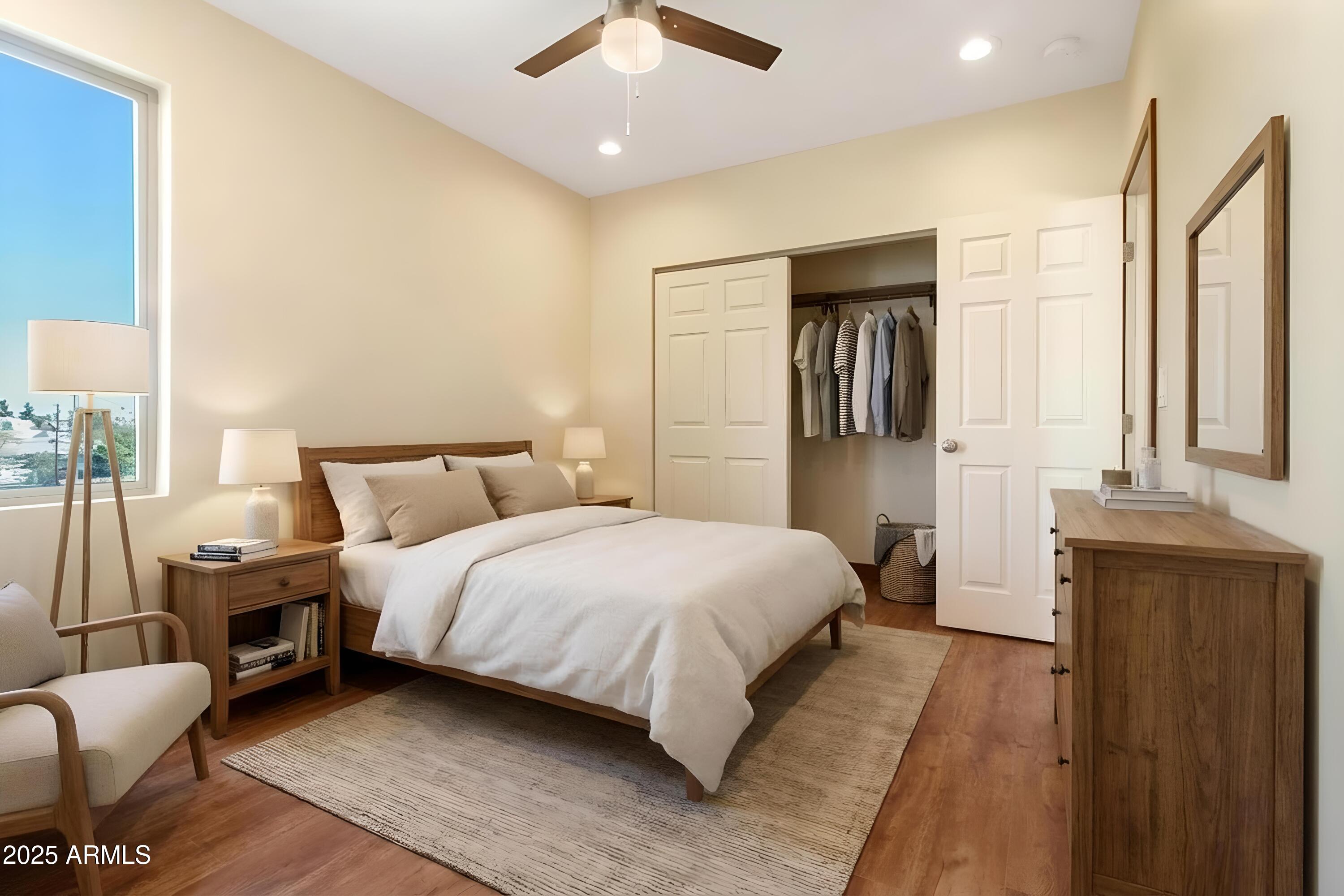 2014 West Lawrence Road Phoenix, AZ 85015 - Photo 20 of 24 a bedroom with a bed couch and a dresser
