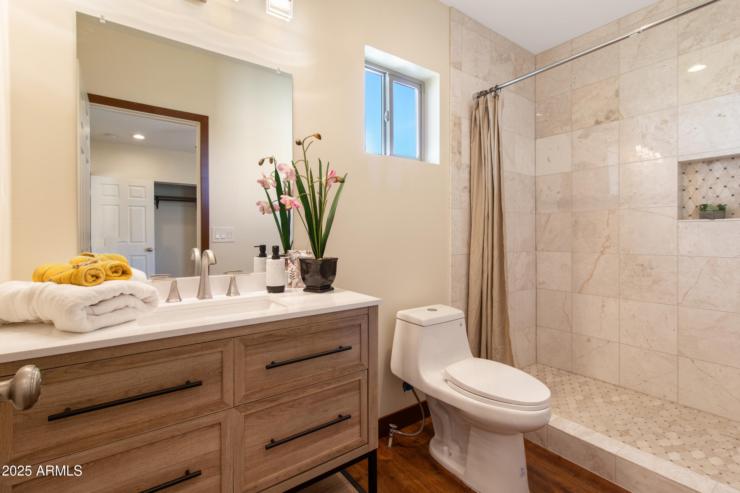2014 West Lawrence Road Phoenix, AZ 85015 - Photo 21 of 24 a bathroom with a sink a toilet and shower