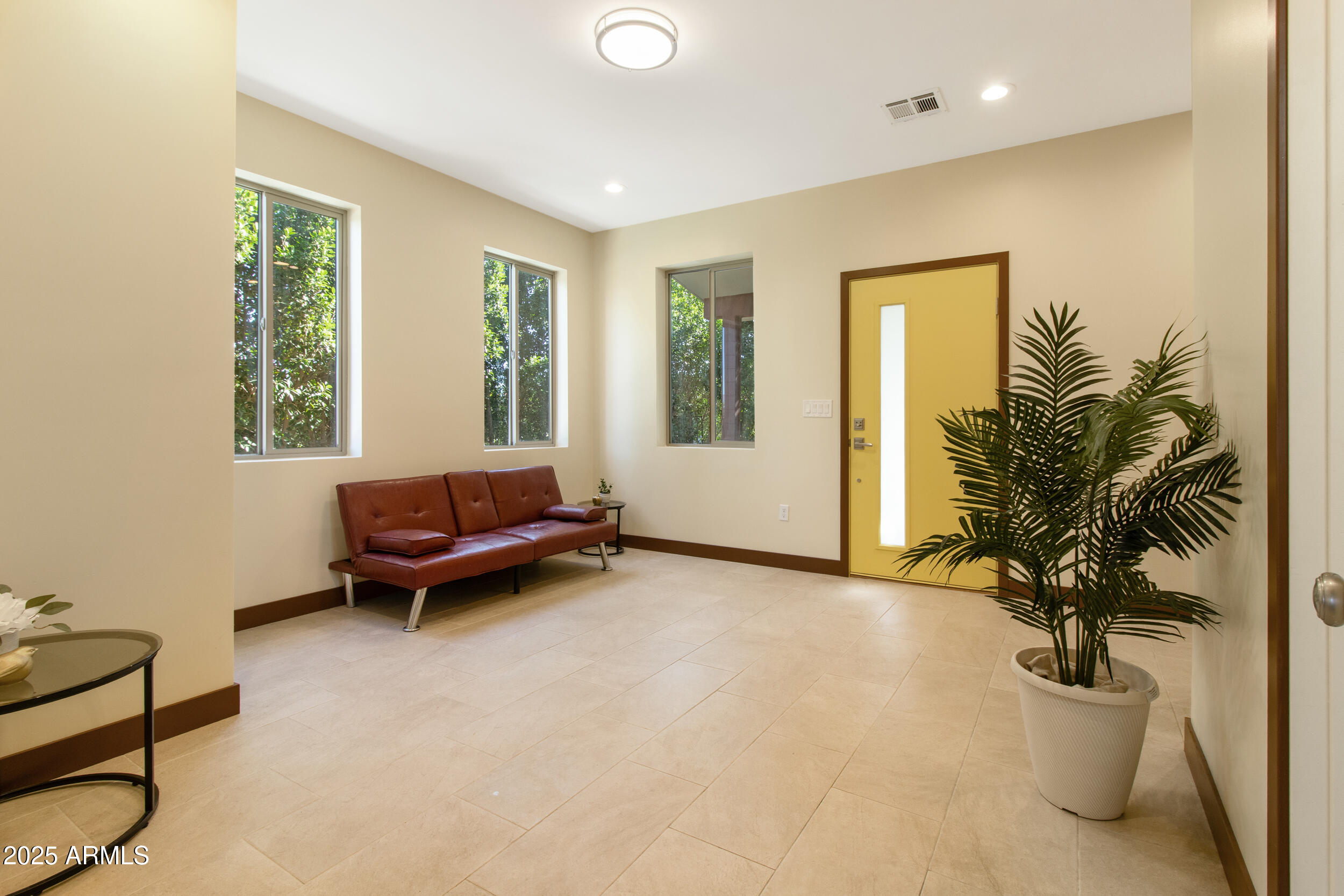 2014 West Lawrence Road Phoenix, AZ 85015 - Photo 5 of 24 a living room with furniture and a potted plant