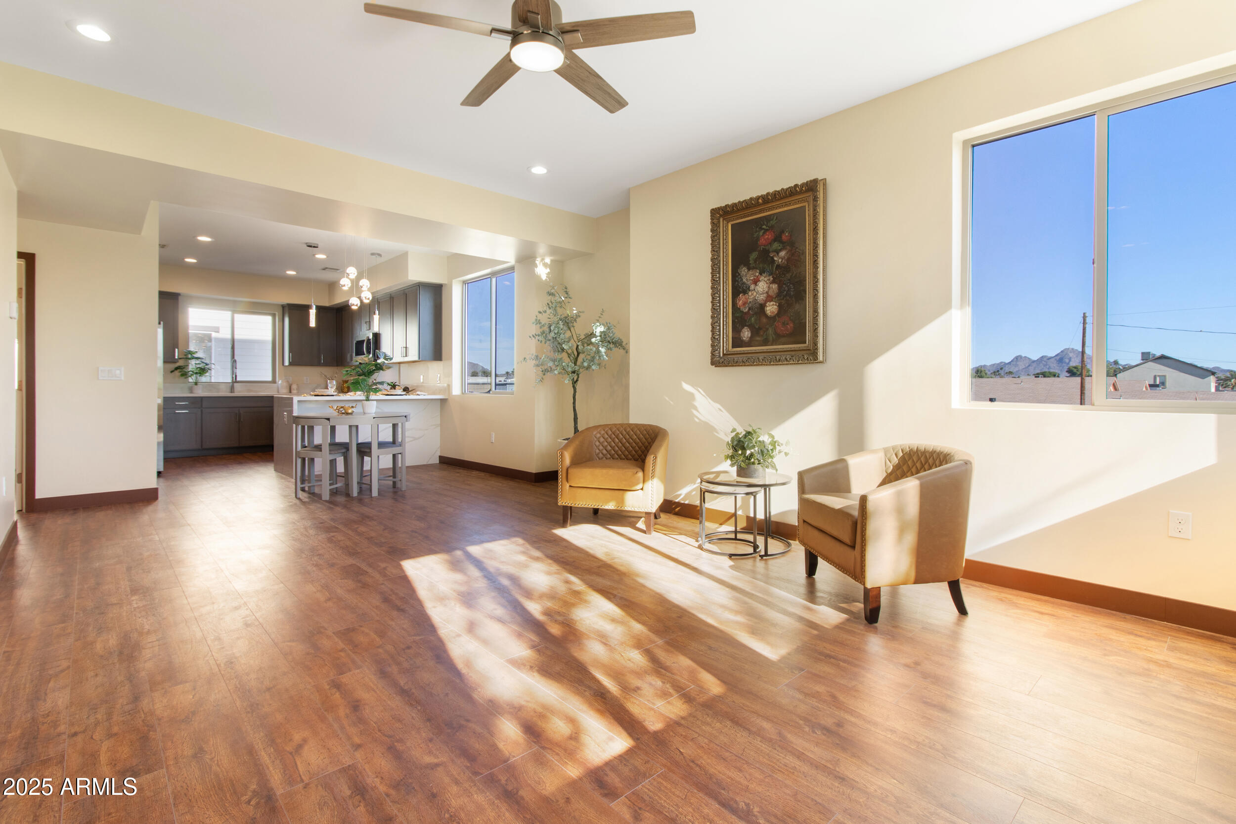2014 West Lawrence Road Phoenix, AZ 85015 - Photo 9 of 24 a living room with furniture and a wooden floor