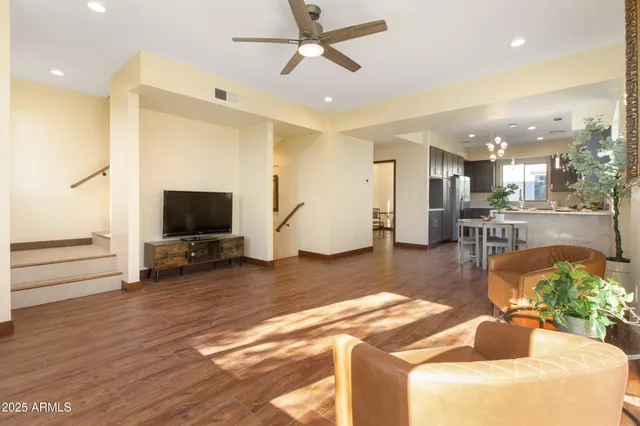 a dining room with furniture and wooden floor